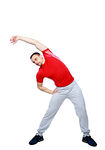 Sports man doing physical exercise for stretching over white background