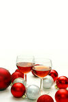 Two Wine Glasses Surrounded by Christmas Decorations